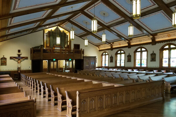 Organ and choir loft lifted to provide enlarged entryway and viewing from foyer.